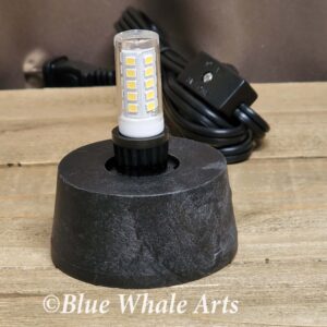 black base with cord and bulb